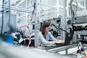 A maker assembling a product in a small workshop.