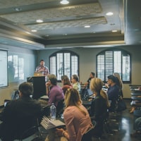 People attending a small workshop session.